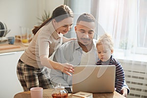Modern Family Using Laptop with Cute Little Girl
