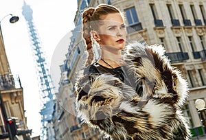 Modern fashion-monger in fur coat in Paris, France