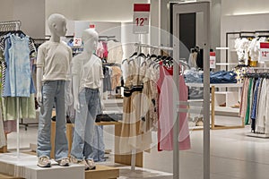 Modern fashionable brand interior of children clothing store inside shopping center