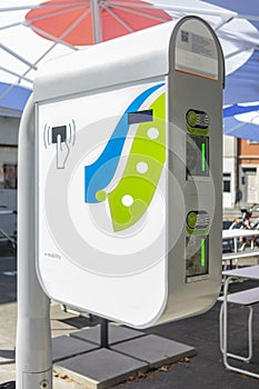 Modern fast charging station for electric vehicles in the city within a parking lot