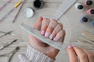 Modern female nude design manicure. Nail care, Self care. Professional Hardware Manicure. Procedure for the preparation of nails.