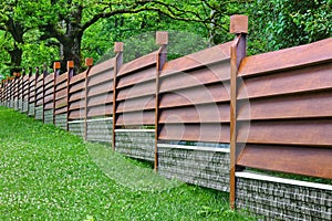 Modern Fence Made From Metal Siding Like As Natural Wood