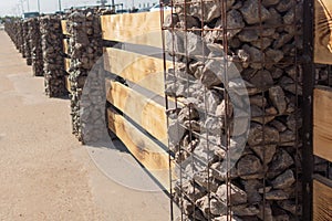 Modern Fence Made From Metal Siding And Profile Sheet Like As Wooden fence made of horizontal boards with stone pillars. The pilla