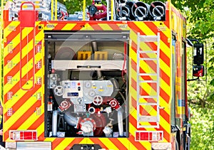 Modern fire engine. Rear view of valves with hydrants