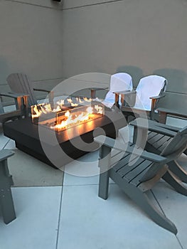 Modern fire pit rooftop patio