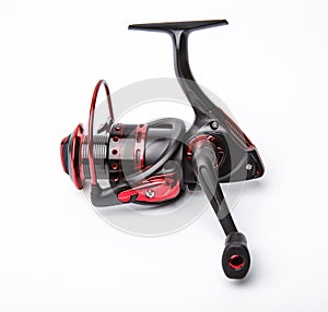 Modern fishing reel on  white background