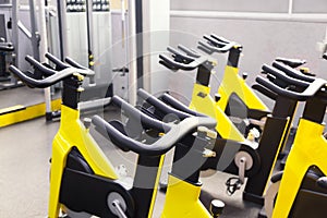 Modern fitness gym. Sports gym or fitness bike equipment