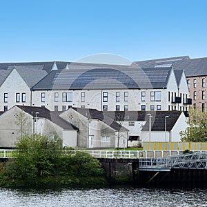 Modern flats built next to old council houses in Govan by the River Clyde photo
