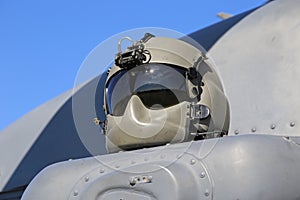 Modern Flight Helmet Displayed on a Helicopter