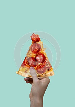 Modern food poster. Woman holding a piece of salami pepperoni pizza. Modern food concept. Advertising, marketing and business.