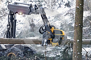 modern forestry machine in a winter forest
