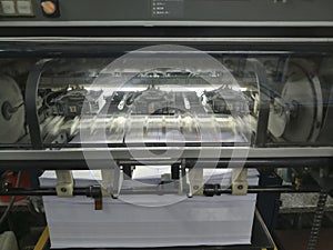 A modern four colour printing machine running in high speed.Shot at Kolkata, West Bengal, India