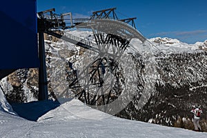 Modern Four-seater Ski Lifts in in Italian Dolomites Alps in Winter Day with Snow