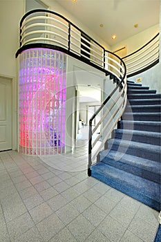 Modern foyer with glass block wall trim