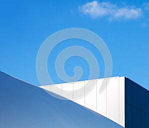 Modern fragment on a construction building, against blue sky