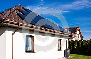 Modern full black solar panels on the roof of a private house