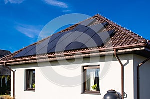 Modern full black solar panels on the roof of a private house