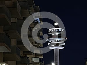 Communications tower lit up in the night