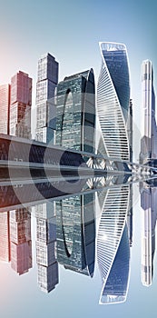 Modern futuristic skyscrapers of steel and glass with reflection