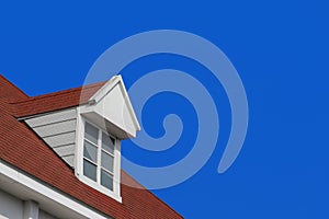 modern gable roof design house wall with clear blue sky background.