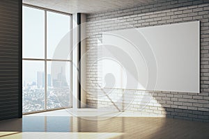 Modern gallery interior with empty poster on brick wall