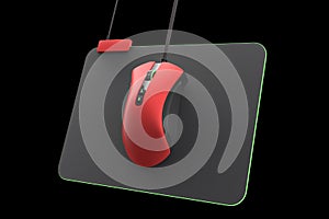 Modern gaming mouse on professional pad on black background with clipping path