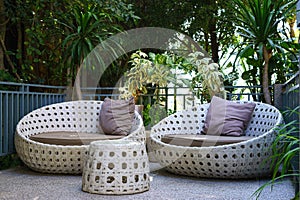 modern garden sofa or love seat in the home garden.