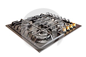 Modern gas hob stove made of steel and cast iron with golden controls using natural gas or propane for cooking products