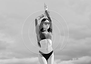 Modern girl. Girl attractive sexy body posing sky background. Booty woman wear bikini. Sporty female sexy body. Resort