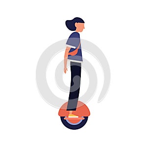 Modern girl riding electric unicycle, monocycle, mono wheel. Trendy young woman on eco friendly personal urban vehicle photo