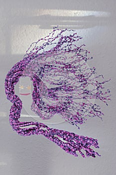 Modern girl starry eyed composite weaving displays pink & purple hair in the desert wind.