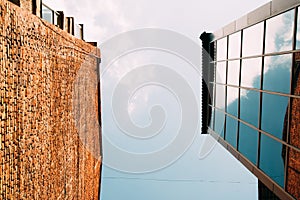 Modern glass and brick buildings, view from below