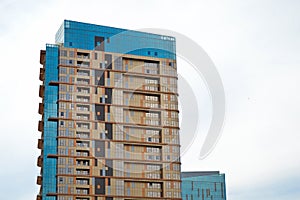 Modern glass building in the city center, business center with blue sky