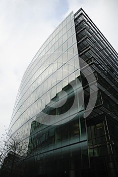 Modern Glass Building Reflecting Neighbouring Building