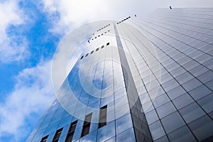 Modern glass building under the blue sky