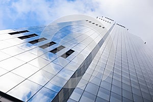 Modern glass building under the blue sky