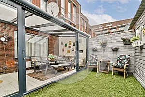 Modern Glass Conservatory in Urban Setting photo