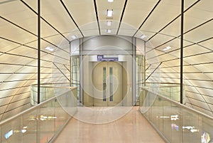 Modern glass elevator at train station
