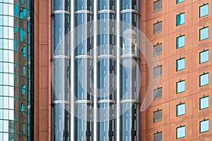 Modern glass elevators or lifts in new business building