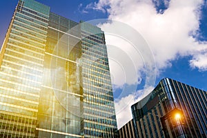 Modern glass exterior of corporate office buildings shot from a