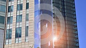 Modern glass facade against blue sky.