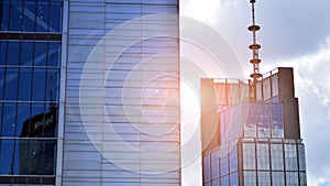 Modern glass facade against blue sky.