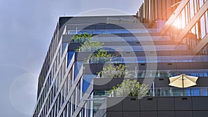 Modern glass facade against blue sky.