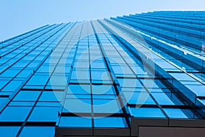 Modern glass  facade of an office building. View from below