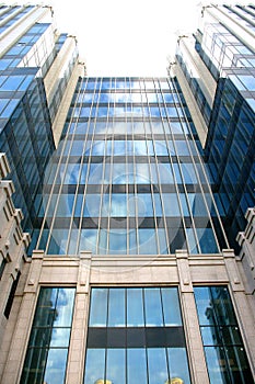 Modern glass fronted building, offices. Sky reflection