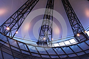 Modern glass roof with metal arches on the ceiling