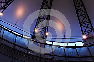 Modern glass roof with metal arches on the ceiling