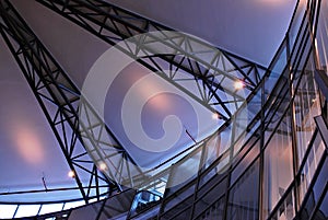 Modern glass roof with metal arches on the ceiling