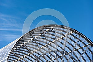 Modern Glass and Steel Architecture on Blue Sky with Clouds