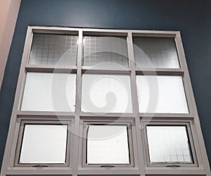 Modern Glass Window Grid on Blue Interior Wall